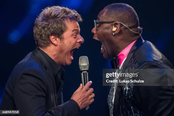 Moderator Oliver Geissen and Alphonso Williams perform during the second event show of the tv competition 'Deutschland sucht den Superstar' at...