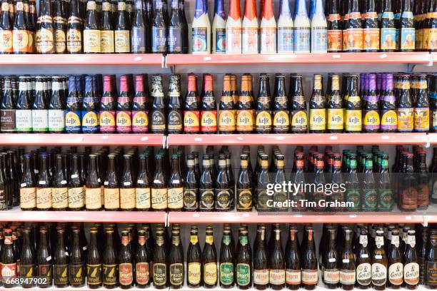 Belgian beers including famous Leffe lager and beer on shelves for sale in shop in Bruges - Brugge - Belgium.