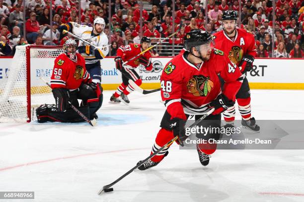 Vinnie Hinostroza of the Chicago Blackhawks controls the puck in the first period against the Nashville Predators in Game Two of the Western...