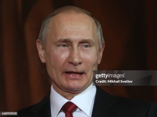 Russian President Vladimir Putin pray during the Easter Service in the Christ The Saviour Cathedral in Moscow, Russia, early April 2017. Eastern...