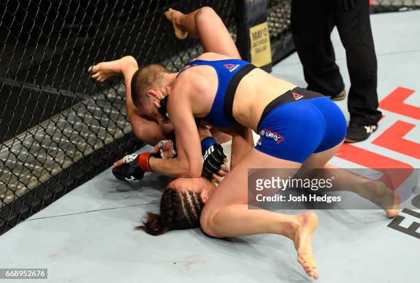Rose Namajunas elbows Michelle Waterson in their women's strawweight fight during the UFC Fight Night event at Sprint Center on April 15, 2017 in...