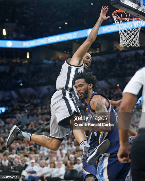 Mike Conley of the Memphis Grizzlies strips the ball from a driving Tony Parker of the San Antonio Spurs in Game One of the Western Conference...