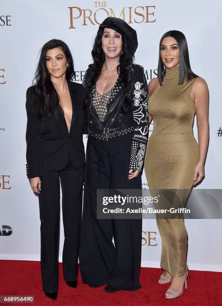 Personality Kourtney Kardashian, singer/actress Cher and TV personality Kim Kardashian arrive at the Premiere of Open Road Films' 'The Promise' at...