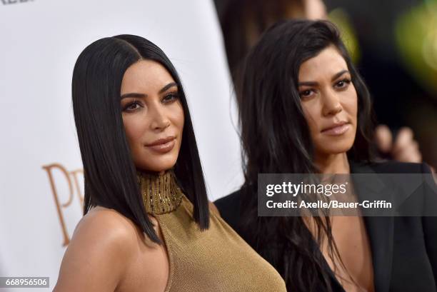 Personalities Kim Kardashian and Kourtney Kardashian arrive at the Premiere of Open Road Films' 'The Promise' at TCL Chinese Theatre on April 12,...