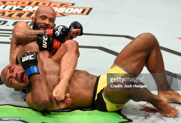 Demetrious Johnson submits Wilson Reis of Brazil in their UFC flyweight fight during the UFC Fight Night event at Sprint Center on April 15, 2017 in...