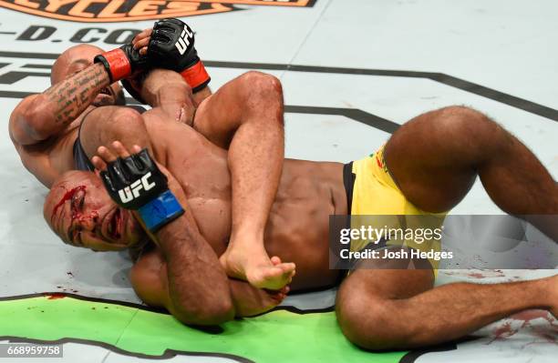 Demetrious Johnson submits Wilson Reis of Brazil in their UFC flyweight fight during the UFC Fight Night event at Sprint Center on April 15, 2017 in...