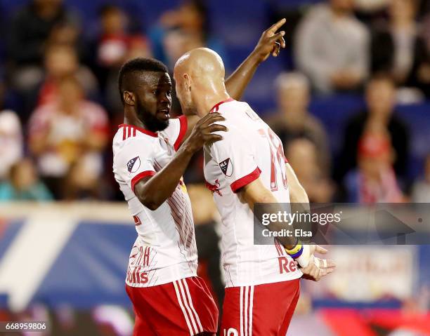 Kemar Lawrence and Aurelien Collin of New York Red Bulls talk before a kick in the second half against the D.C. United at Red Bull Arena on April 15,...