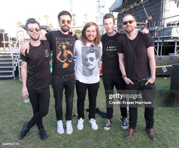 Musicians Kyle J Simmons, Charlie Barnes, Chris "Woody" Wood, Dan Smith and Will Farquarson of Bastille pose backstage at the Outdoor Stage during...