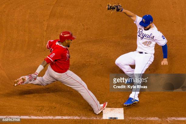 Eric Hosmer of the Kansas City Royals tags out Yunel Escobar of the Los Angeles Angels of Anaheim in the sixth inning at Kauffman Stadium on April...