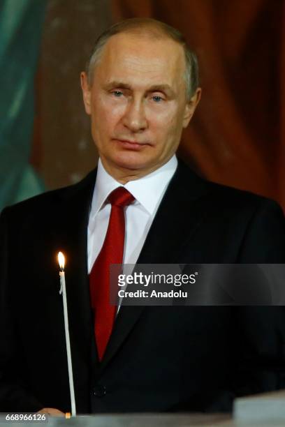 Russian President Vladimir Putin attend the Easter service led by Patriarch Kirill of Russia in Christ the Savior Cathedral in Moscow, Russia, on...