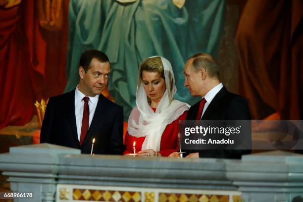 Russian President Vladimir Putin attends an Easter service led by Patriarch Kirill of Russia in Christ the Savior Cathedral in Moscow, Russia, on...