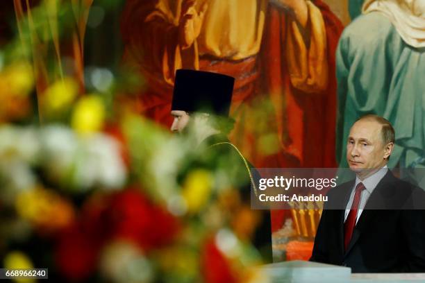 Russian President Vladimir Putin attend the Easter service led by Patriarch Kirill of Russia in Christ the Savior Cathedral in Moscow, Russia, on...
