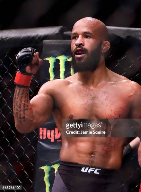 Demetrious Johnson celebrates after defeating Wilson Reis to win their Flyweight Championship bout on UFC Fight Night at the Sprint Center on April...