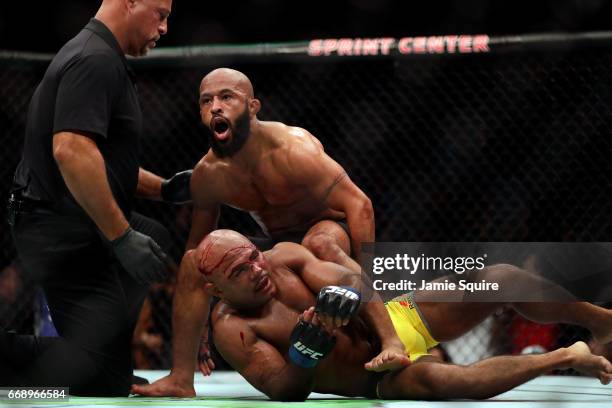 Demetrious Johnson celebrates as he defeats Wilson Reis to win their Flyweight Championship bout on UFC Fight Night at the Sprint Center on April 15,...