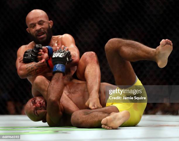 Demetrious Johnson takes down Wilson Reis during their Flyweight Championship bout on UFC Fight Night at the Sprint Center on April 15, 2017 in...