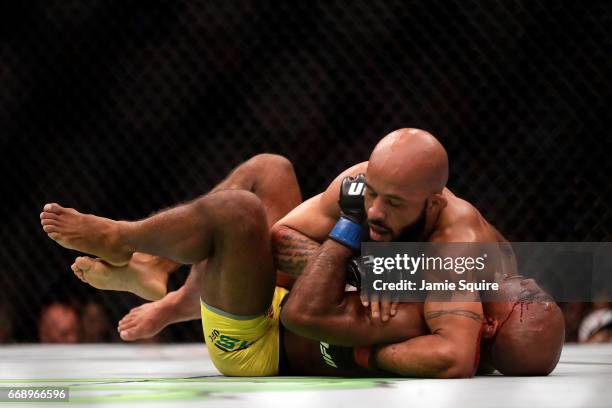 Demetrious Johnson takes down Wilson Reis during their Flyweight Championship bout on UFC Fight Night at the Sprint Center on April 15, 2017 in...