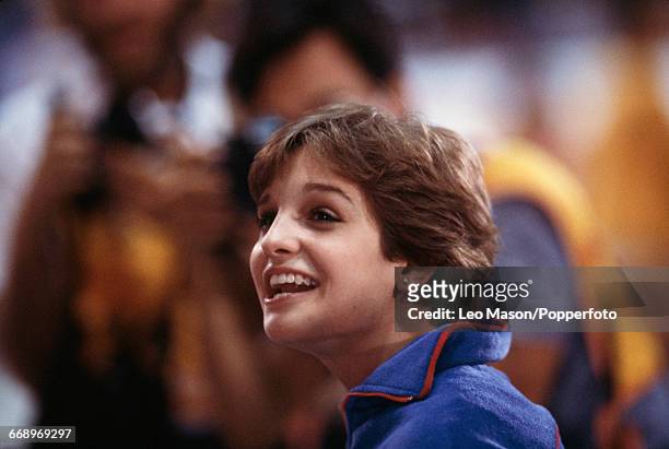 American gymnast Mary Lou Retton smiles after finishing in first place to win the gold medal in the Women's artistic individual all-around event at...