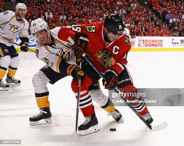 Jonathan Toews of the Chicago Blackhawks and Calle Jarnkrok of the Nashville Predators battle for the puck after a faceoff in Game Two of the Western...