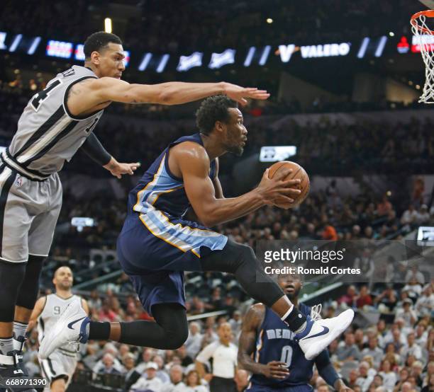 Wayne Selden of the Memphis Grizzlies drives under Danny Green of the San Antonio Spurs in Game One of the Western Conference Quarterfinals during...