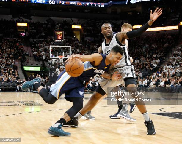 Andrew Harrison of the Memphis Grizzlies drives on Jonathon Simmons of the San Antonio Spurs in Game One of the Western Conference Quarterfinals...