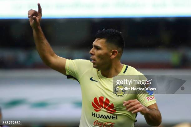 Silvio Romero of America celebrates after scoring the first goal of his team during the 14th round match between America and Queretaro as part of the...