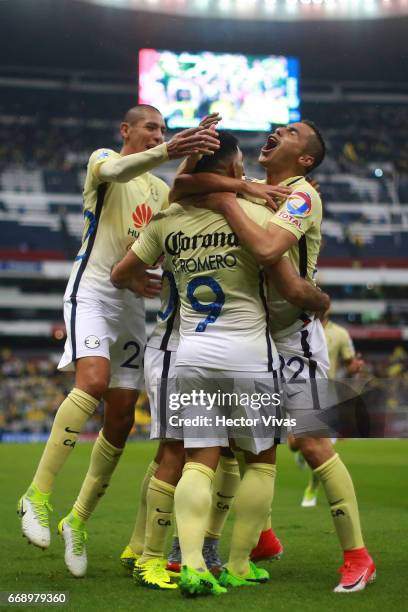 Silvio Romero of America celebrates with teammates after scoring the first goal of his team during the 14th round match between America and Queretaro...