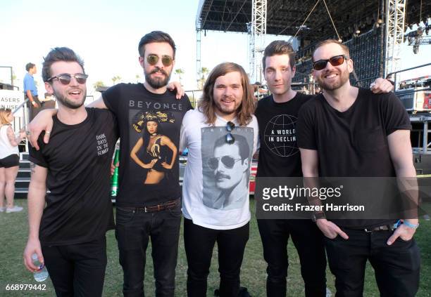 Musicians Kyle J Simmons, Charlie Barnes, Chris "Woody" Wood, Dan Smith and Will Farquarson of Bastille pose backstage at the Outdoor Stage during...