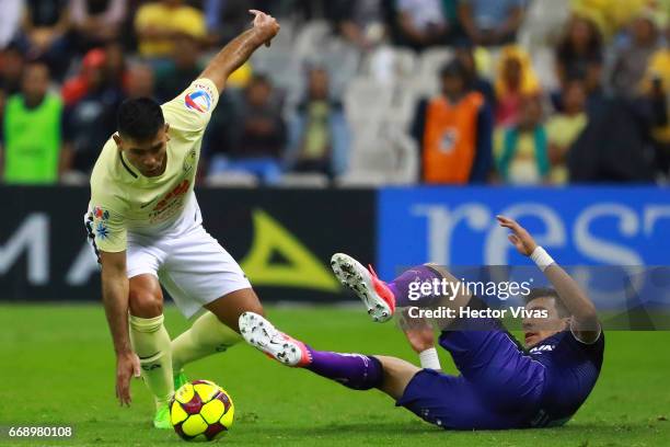 Edgar Benitez of Queretaro struggles for the ball with Silvio Romero of America during the 14th round match between America and Queretaro as part of...