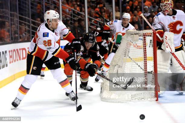 Jakob Silfverberg of the Anaheim Ducks defends as Michael Stone of the Calgary Flames passes the puck during the third period of Game Two of the...