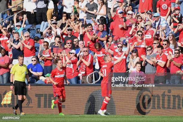 Chicago Fire midfielder Bastian Schweinsteiger shakes hands with a fan during a game between the Chicago Fire and New England Revolution on April 15...