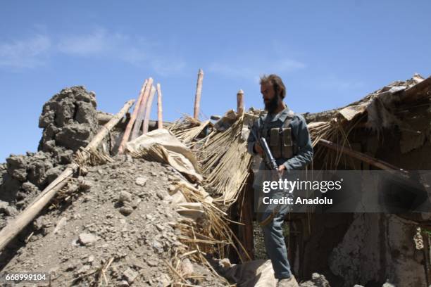 Debris of a collapsed building is seen in the Acin district after The US military dropped America's most powerful non-nuclear bomb on Daesh targets...