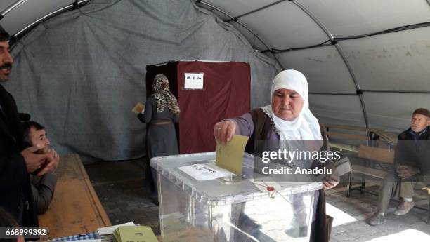 Citizen, who is an earthquake victim, casts her vote in the constitutional referendum at a polling station in Adiyaman, Turkey on April 16, 2017....