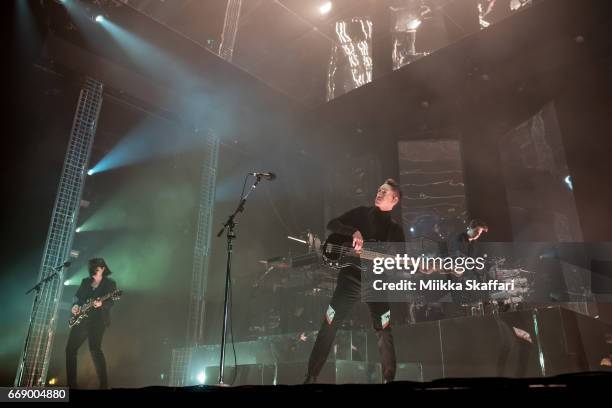 Romy Madley Croft, Oliver Sim and Jamie Smith of The XX perform at Bill Graham Civic Auditorium on April 15, 2017 in San Francisco, California.