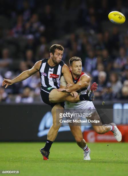 Jarryd Blair of the Magpies kicks the ball for a goal Nathan Brown during the round four AFL match between the Collingwood Magpies and the St Kilda...