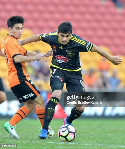 Guilherme Finkler of the Phoenix breaks away from the defence during the round 27 A-League match between the Brisbane Roar and the Wellington Phoenix...