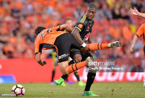 Rolieny Bonevacia of the Phoenix is penalised for this challenge on Thomas Broich of the Roar during the round 27 A-League match between the Brisbane...