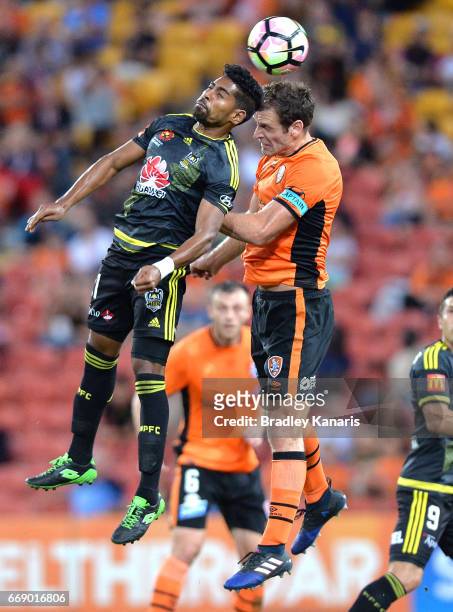 Roy Krishna of the Phoenix and Luke DeVere of the Roar challenge for the ball during the round 27 A-League match between the Brisbane Roar and the...