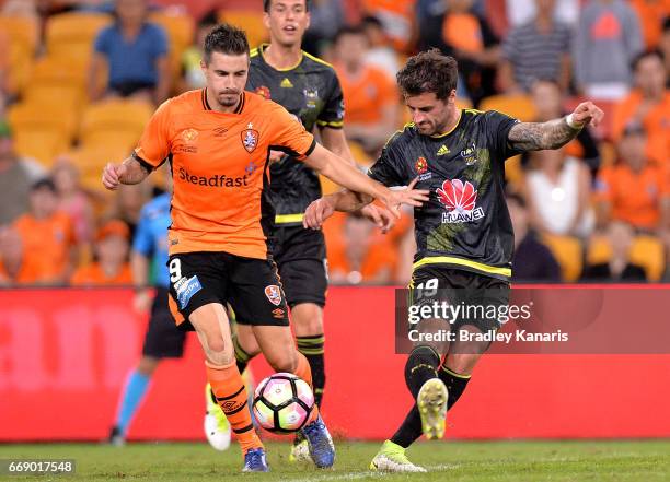 Jamie Maclaren of the Roar and Thomas Doyle of the Phoenix compete for the ball during the round 27 A-League match between the Brisbane Roar and the...