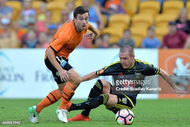 Tommy Oar of the Roar breaks away from the defence during the round 27 A-League match between the Brisbane Roar and the Wellington Phoenix at Suncorp...