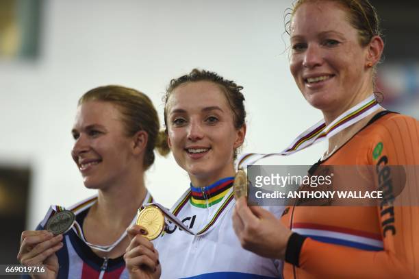 Winner Elinor Barker of Britain poses with bronze medallist Kirsten Wild of the Netherlands and silver medallist Sarah Hammer of the US after the...