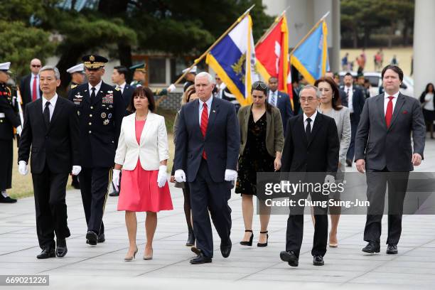 Vice President Mike Pence and his wife Karen Pence visit at Seoul National Cemetery on April 16, 2017 in Seoul, South Korea. During the three day...