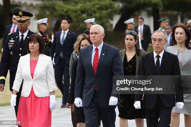 Vice President Mike Pence and his wife Karen Pence visit at Seoul National Cemetery on April 16, 2017 in Seoul, South Korea. During the three day...