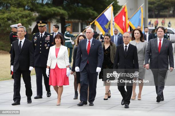 Vice President Mike Pence and his wife Karen Pence visit at Seoul National Cemetery on April 16, 2017 in Seoul, South Korea. During the three day...