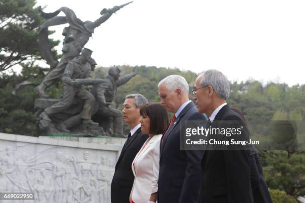 Vice President Mike and his wife Karen Pence pay a silent tribute at Seoul National Cemetery on April 16, 2017 in Seoul, South Korea. During the...