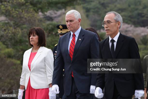 Vice President Mike Pence and his wife Karen Pence visit at Seoul National Cemetery on April 16, 2017 in Seoul, South Korea. During the three day...