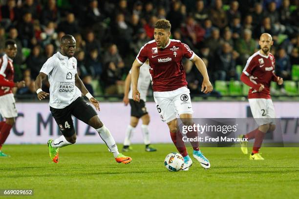 Ismael Diomande of Caen and Simon Falette of Metz during the Ligue 1 match between Fc Metz and SM Caen at Stade Saint-Symphorien on April 15, 2017 in...