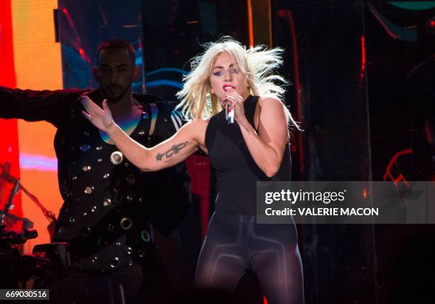 Pop singer Lady Gaga performs on stage at the Coachella Valley Music And Arts Festival on April 15, 2017 in Indio, California. / AFP PHOTO / VALERIE...