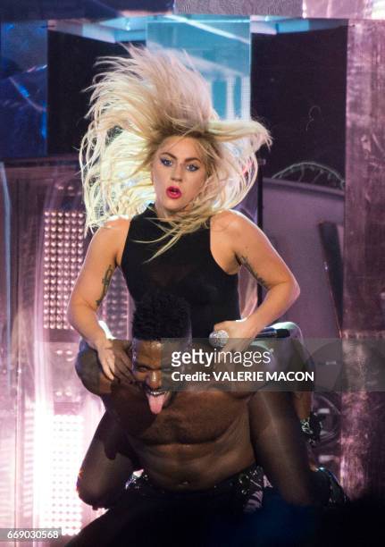 Pop singer Lady Gaga performs on stage at the Coachella Valley Music And Arts Festival on April 15, 2017 in Indio, California. / AFP PHOTO / VALERIE...