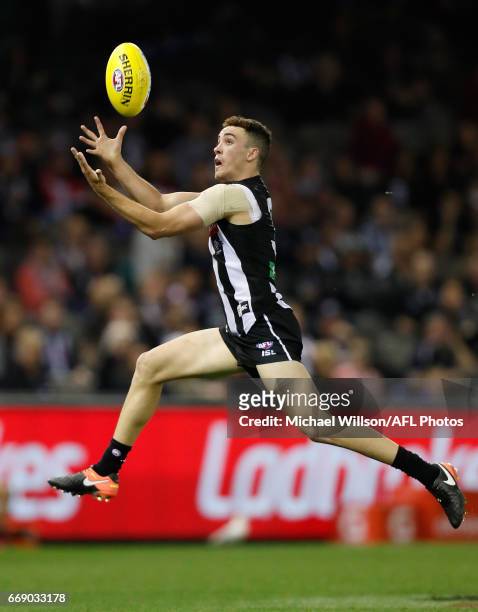 Jackson Ramsay of the Magpies marks the ball during the 2017 AFL round 04 match between the Collingwood Magpies and the St Kilda Saints at Etihad...