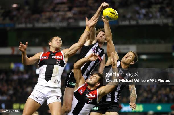 Maverick Weller of the Saints, Tyson Goldsack of the Magpies, Josh Bruce of the Saints and Jesse White of the Magpies compete for the ball during the...